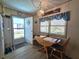 Cozy dining area with a table, chairs, and a view of the outdoors at 5102 Pigeon Plum Cir, New Port Richey, FL 34653