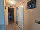 Hallway with wood-look flooring and closet access at 5102 Pigeon Plum Cir, New Port Richey, FL 34653