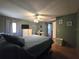 The main bedroom has a ceiling fan, ensuite bathroom and a desk space for a home office at 5102 Pigeon Plum Cir, New Port Richey, FL 34653