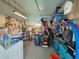 Storage room well organized, with shelving and ample space for storing tools and equipment at 5102 Pigeon Plum Cir, New Port Richey, FL 34653