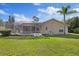 The exterior showcases a screened-in lanai and pool, perfect for enjoying the outdoors in a comfortable setting at 5412 Merkin Pl, New Port Richey, FL 34655