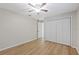 The empty bedroom features lots of closet space and hardwood floors at 5412 Merkin Pl, New Port Richey, FL 34655