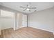 Bedroom with hardwood floors, fan and a large closet at 5412 Merkin Pl, New Port Richey, FL 34655