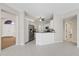 Open kitchen with white cabinets, stainless steel appliances and tile flooring at 5412 Merkin Pl, New Port Richey, FL 34655
