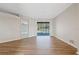 Bright living room with sliding glass doors offering backyard and pool views at 5412 Merkin Pl, New Port Richey, FL 34655