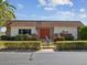 Exterior view of the Cedar Pointe building featuring a brown roof and an orange entryway at 6037 Chesham Dr # 3, New Port Richey, FL 34653