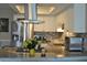 Stylish kitchen with stainless steel appliances and a breakfast bar perfect for entertaining guests at 6037 Chesham Dr # 3, New Port Richey, FL 34653