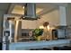 Updated kitchen featuring modern appliances, granite countertops, and a breakfast bar for casual dining at 6037 Chesham Dr # 3, New Port Richey, FL 34653