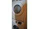 A stacked washer and dryer are visible in this laundry closet at 6037 Chesham Dr # 3, New Port Richey, FL 34653
