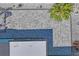 Overhead view of light blue house, gray stone pavers, white rock, gray shingles, and white privacy fence at 7221 Westwind Dr, Port Richey, FL 34668