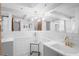 Bright bathroom featuring subway tile walls, modern fixtures, and elegant lighting at 7221 Westwind Dr, Port Richey, FL 34668