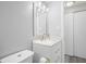 Bathroom with quartz countertops, and a mirrored vanity with Hollywood lighting at 7221 Westwind Dr, Port Richey, FL 34668