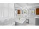 Bathroom with a white subway tile backsplash and modern gold-toned fixtures at 7221 Westwind Dr, Port Richey, FL 34668