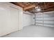 Finished garage with painted walls and floor, and insulated garage door at 7221 Westwind Dr, Port Richey, FL 34668
