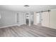 Spacious living area featuring new flooring, neutral walls, and modern architectural details throughout at 7221 Westwind Dr, Port Richey, FL 34668