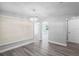 Living room with a modern chandelier, archway and hardwood floors at 7221 Westwind Dr, Port Richey, FL 34668
