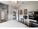 Bright and airy bedroom with a neutral color palette and a view into the dining room at 7511 Melogold Cir, Land O Lakes, FL 34637
