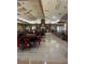 Spacious event room, featuring neutral colors, brick fireplace, and ample seating for any gathering at 7511 Melogold Cir, Land O Lakes, FL 34637