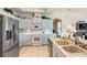 Bright kitchen features white appliances, neutral countertops, and a mosaic backsplash at 7511 Melogold Cir, Land O Lakes, FL 34637