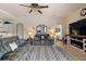 Cozy living room featuring a fireplace, entertainment center, and neutral color palette at 7511 Melogold Cir, Land O Lakes, FL 34637
