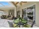 Inviting outdoor patio with comfortable seating, ceiling fan, and view of the pool area at 7511 Melogold Cir, Land O Lakes, FL 34637