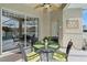 Relaxing covered patio with a dining table, chairs, and view of the pool area at 7511 Melogold Cir, Land O Lakes, FL 34637