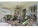 Comfortable covered patio with cozy seating, ceiling fan, and a relaxing atmosphere at 7511 Melogold Cir, Land O Lakes, FL 34637