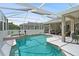 Resort-style pool with a spa, covered patio, and ample space for outdoor entertaining at 7511 Melogold Cir, Land O Lakes, FL 34637