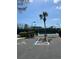 Tennis court with shade trees and parking, offering a convenient and enjoyable recreational space at 7511 Melogold Cir, Land O Lakes, FL 34637