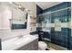 Bathroom featuring a shower, granite counters, and modern fixtures at 7925 Calindra Ct, Trinity, FL 34655