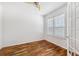 Bedroom featuring hardwood floors, neutral walls, and natural light at 7925 Calindra Ct, Trinity, FL 34655