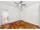 Bedroom featuring hardwood floors, neutral walls, ceiling fan, and natural light at 7925 Calindra Ct, Trinity, FL 34655
