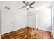 Bedroom featuring hardwood floors, neutral walls, closet, and natural light at 7925 Calindra Ct, Trinity, FL 34655