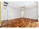 Large bonus room features wood floors, white walls, white doors and multiple A/C vents at 7925 Calindra Ct, Trinity, FL 34655