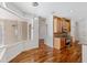 Open breakfast nook area with hardwood floors, pendant lighting, and views of the lanai at 7925 Calindra Ct, Trinity, FL 34655