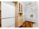 Walk-in closet featuring custom shelves, cabinets, and plenty of hanging space at 7925 Calindra Ct, Trinity, FL 34655