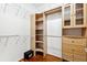 Well-organized walk-in closet with custom shelving and cabinets at 7925 Calindra Ct, Trinity, FL 34655