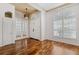 Inviting foyer with wood floors, transom windows, and double front doors at 7925 Calindra Ct, Trinity, FL 34655