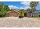 Charming single-Gathering home with a spacious driveway and well-maintained landscaping, including palm trees at 7925 Calindra Ct, Trinity, FL 34655