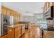 Spacious kitchen with stainless steel appliances, center island and breakfast nook with pool view at 7925 Calindra Ct, Trinity, FL 34655