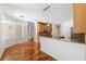 Open kitchen and breakfast nook area with hardwood floors, wooden cabinetry and granite countertops at 7925 Calindra Ct, Trinity, FL 34655