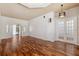 Expansive living area features wood floors, high ceilings, and ample natural light at 7925 Calindra Ct, Trinity, FL 34655