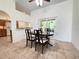 Stylish dining room offering great natural light and seamless access to the outdoor patio at 9348 Villa Entrada, New Port Richey, FL 34655