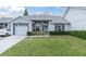 Inviting home exterior with lush front yard and well-maintained landscaping, enhancing curb appeal at 9348 Villa Entrada, New Port Richey, FL 34655