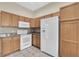 Cozy kitchen showcasing modern appliances, granite countertops, and ample cabinet space at 9348 Villa Entrada, New Port Richey, FL 34655