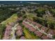 Aerial view of a residential neighborhood with golf course, mature trees, and well-maintained lawns at 9636 Brookdale Dr, New Port Richey, FL 34655