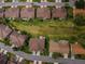 An aerial view of residential homes and green space in the surrounding community at 9636 Brookdale Dr, New Port Richey, FL 34655