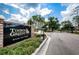 Timber Greens entrance sign at Royale Oak Village with manicured landscaping and gated entry at 9636 Brookdale Dr, New Port Richey, FL 34655