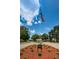 Timber Greens community entrance featuring an American flag and manicured landscaping at 9636 Brookdale Dr, New Port Richey, FL 34655