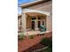 Inviting covered front entrance with space for seating, landscaping and charming decor at 9636 Brookdale Dr, New Port Richey, FL 34655
